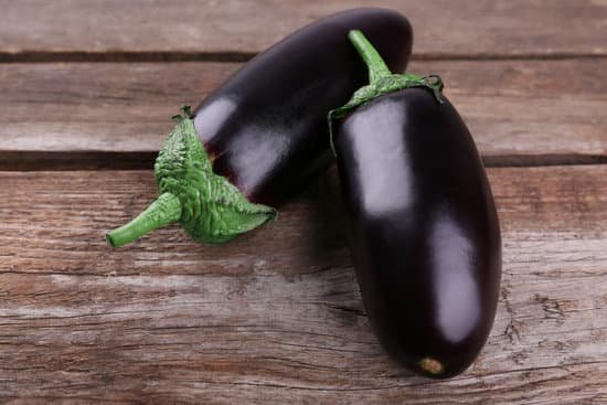 canva two fresh eggplant on wooden background MAD MVIr54I