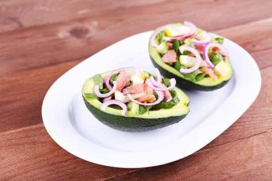 canva two stuffed avocados on a plate MAD L87HTPY