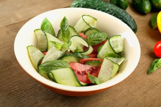 canva vegetable salad with cucumbers on wooden background MAD Ms8mUgU