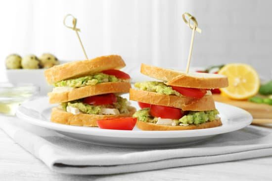 canva vegetarian avocado sandwich on a white plate MAD Quh sOM