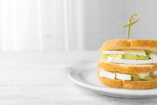 canva vegetarian avocado sandwich on white plate MAD Qh7OXKg
