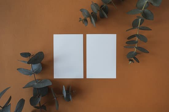 canva white blank papers with eucalyptus branches on brown background MAEAKTmg6s8