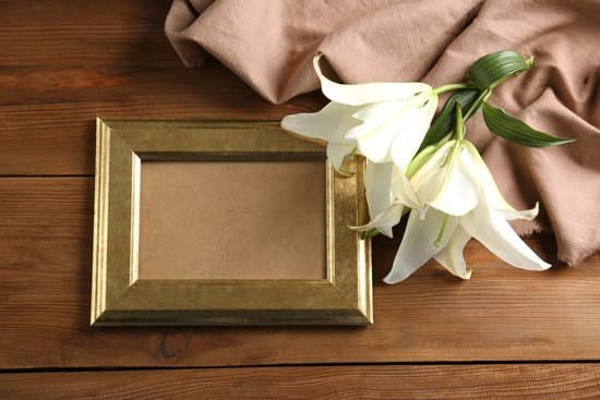 canva white lily and frame on table MAD9aXBeoOs