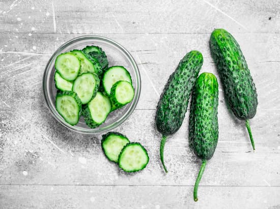 canva whole cucumbers and cucumber slices in the bowl flatlay MAEPOfrqlcI