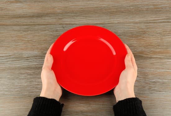 canva woman hands holding empty plate top view MAEsBBbBPBM