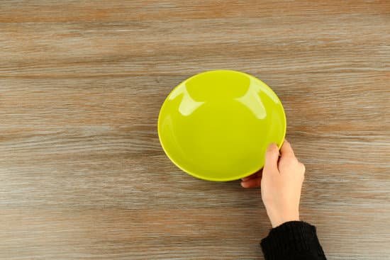 canva woman hands holding empty plate top view MAEsBKtiWHc