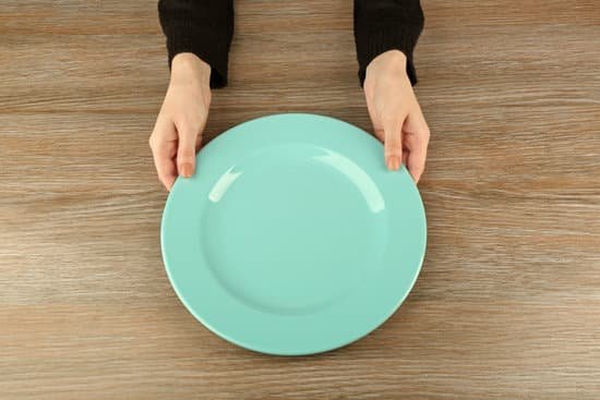 canva woman hands holding empty plate top view MAEsBLvmzcE