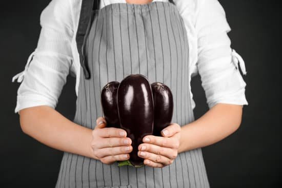 canva woman holding eggplants MAD9T1nQ1K4