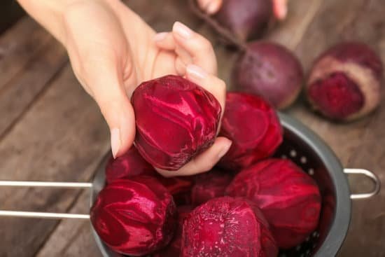 canva woman holding fresh beets MAD9bobw Z0