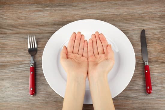 canva woman holding hands together over plate top view MAEsBKCUjEU