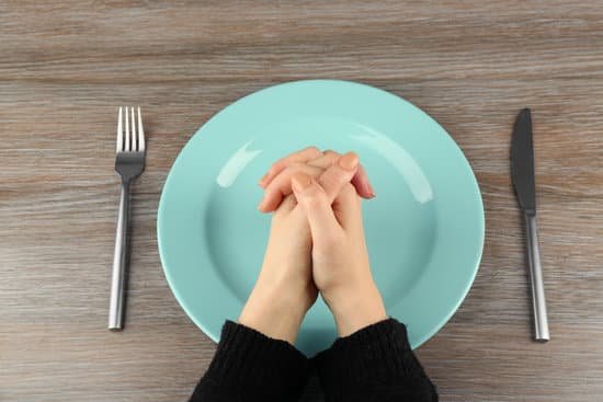 canva woman holding hands together over plate top view MAEsBPEZyyc