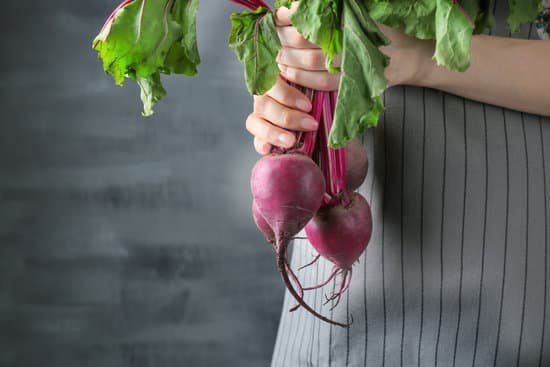 canva woman holding young beets MAD9btdHOGo