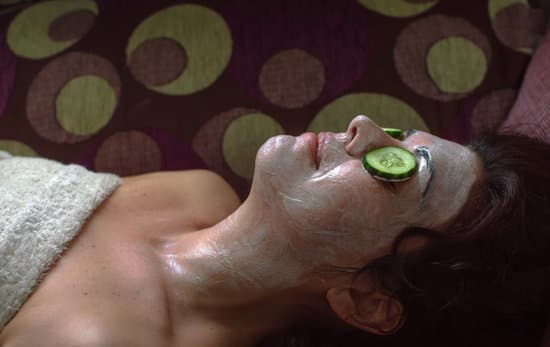 canva woman using organic anti aging mask and cucumber MAENz7CrJeQ