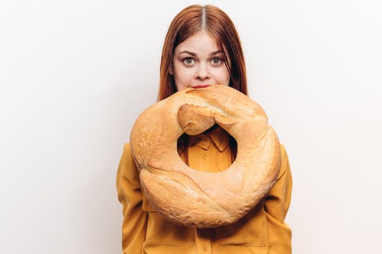 canva woman with loaf of bread flour product hunger calories diet MAEVtG2sLbs