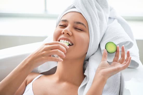 canva womans head wrapped in towel eating cucumber slices MAD7pGoTMT4