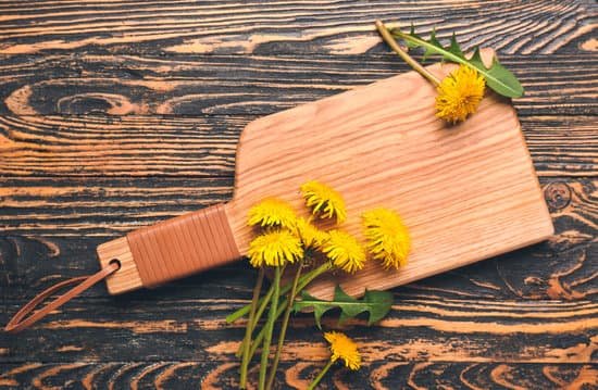 canva wooden board and beautiful dandelions on wooden background MAD8BSMg3to