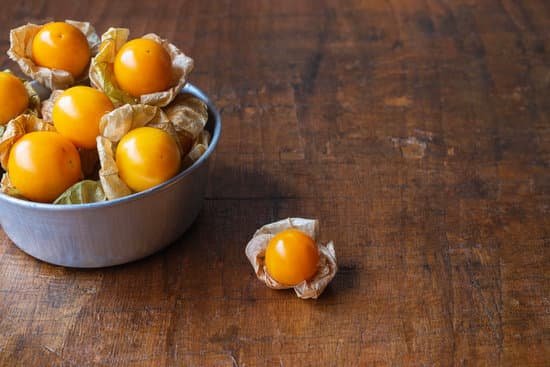 canva yellow gooseberries on wooden background MAEElTvFOcE