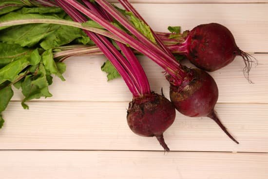 canva young beets on wooden table MAD MSzYBTc