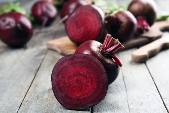 canva young beets on wooden table close up MAD MbqTuZg