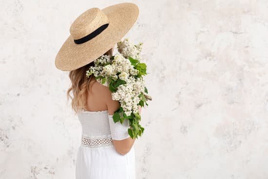 canva young woman with bouquet of lilac flowers on light background MAD8BVh5K10