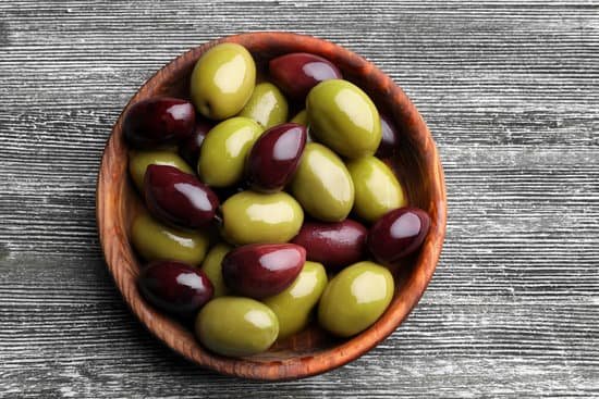 canva a wooden bowl of green and red olives MAD9T25Gu6Y