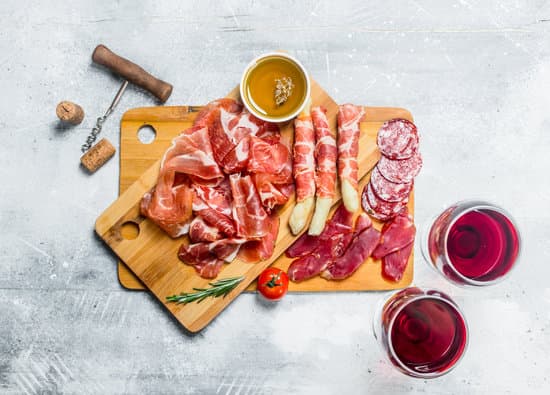 canva assortment of meat snacks with red wine MAEQGqkovVA