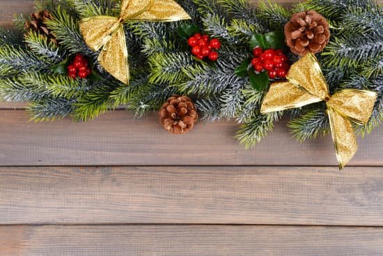 canva beautiful christmas border from fir and mistletoe on wooden background MAD