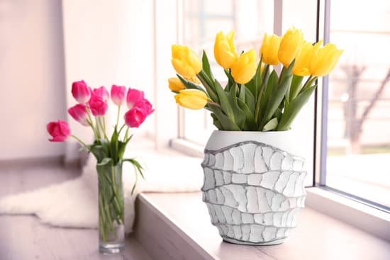 canva beautiful fresh tulips on windowsill indoors MAD QrKIWoU