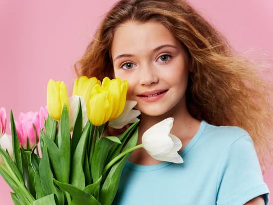 canva beautiful girl holding bouquet of tulips MAD6rtXHtAw