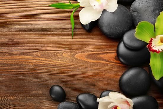 canva beautiful spa composition with stones and orchids on wooden background MAD QngM72o