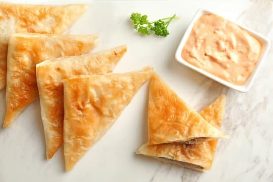 canva board with delicious meat samosas MAD9UXeP1 k