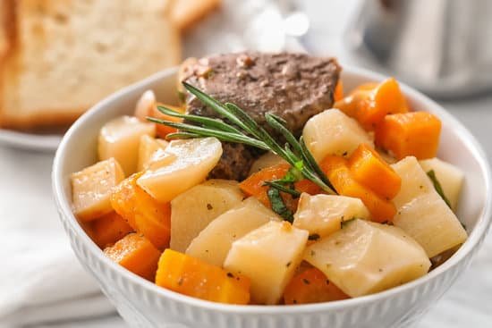 canva bowl with tasty meat and potatoes on a table MAD9Tua1qGw