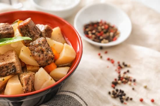canva bowl with tasty meat and potatoes on table MAD9TkQcQns