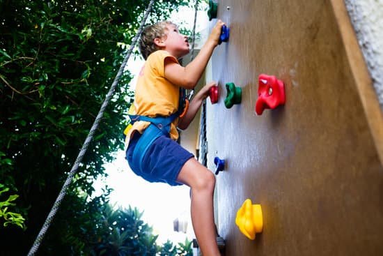 canva boy playing climbing on climbing wall MAEFSc35A 0