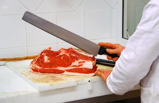 canva butcher slicing meat with knife MAEJdiFtwDA