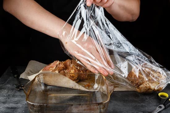 canva chef putting marinated meat in a plastic bag