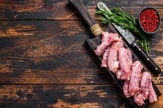 canva chicken neck meat on a cutting board copy space MAEQ3Tfd3Gc