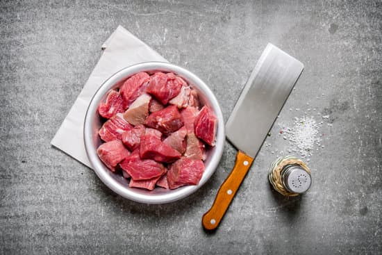 canva chopped raw meat with a butcher knife and salt. MAESnW51qfY