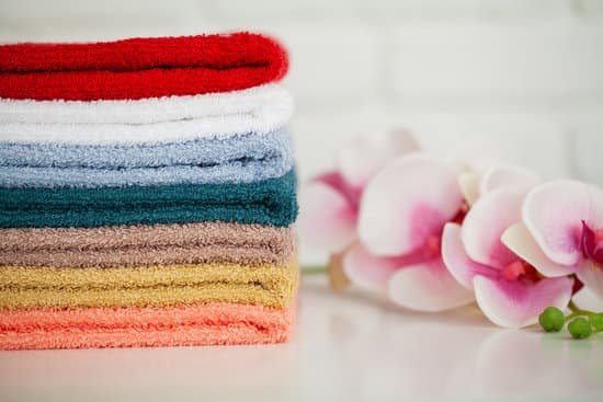 canva colorful towels and a branch of an orchid MAD8imQO9rY