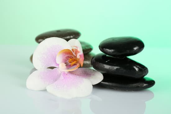 canva composition of spa stones with orchid MAD MMT8D50
