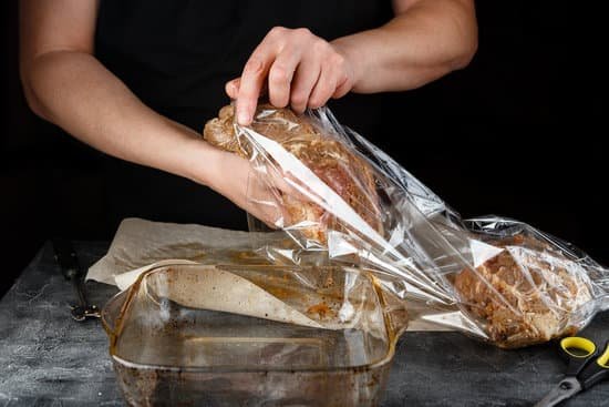canva cook putting marinated meat in a plastic bag