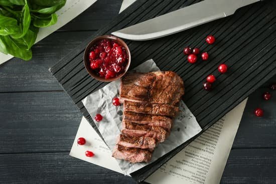 canva cutting board with delicious sliced meat and cranberry sauce flatlay MAD9bBeF oY