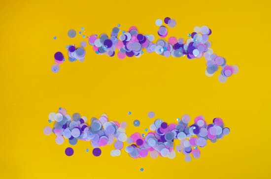 canva festive orange background with violet confetti. MAEQXe0GjNc