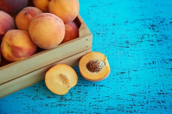 canva fresh peaches in a box on a blue background MAD