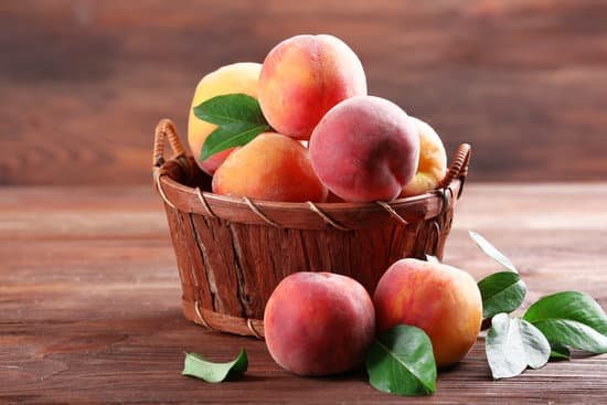 canva fresh peaches in a wicker basket MAD Mgggilk