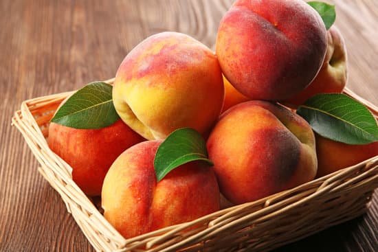 canva fresh peaches in a wicker basket MAD MjtJ9kE