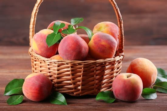 canva fresh peaches in wicker basket on wooden background MAD MrUuA 8