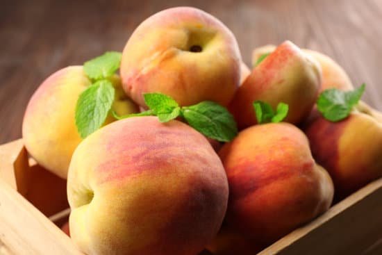 canva fresh peaches in wooden crate MAD MiWnEKs