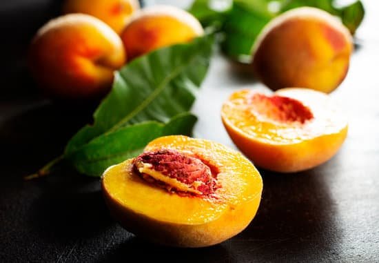 canva fresh peaches on a table MAEIWDv0ztE