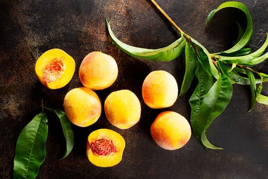 canva fresh peaches on a table MAEIWKWIQJ4